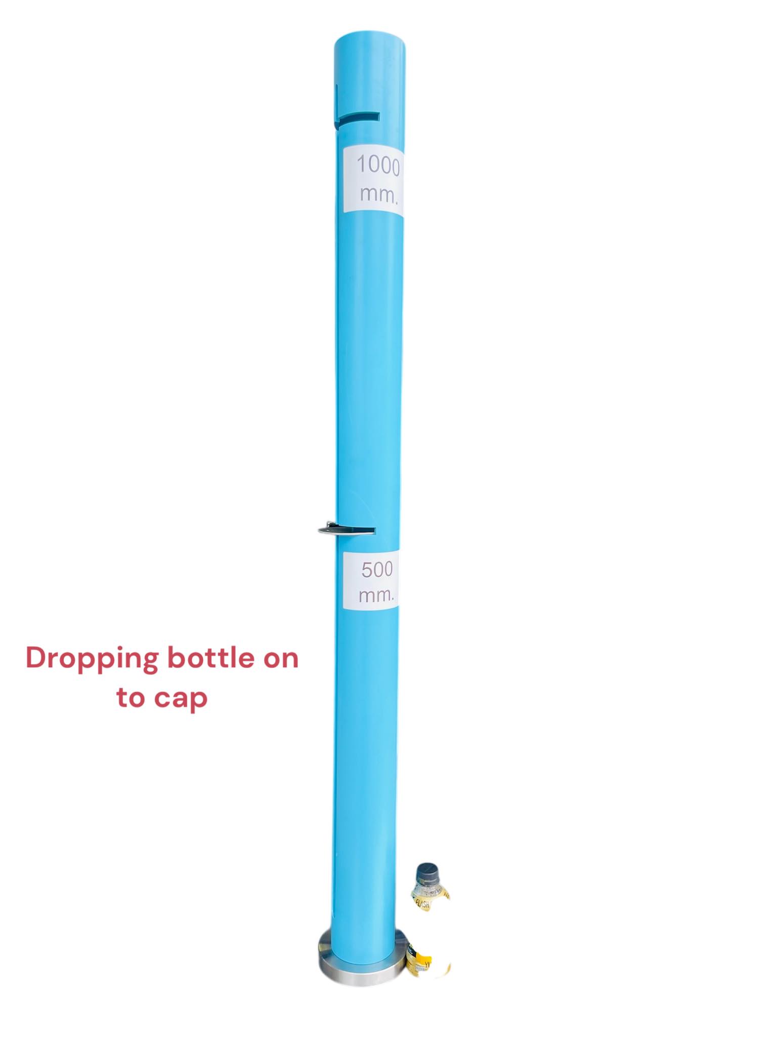 Dropping bottle on to cap